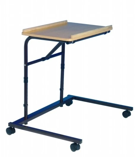 Height adjustable over armchair table with beech effect top and castors.