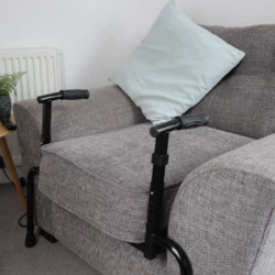 Adjustable sofa stand assist attached to a grey sofa.