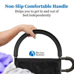 Hand holding a non-slip handle on a bed assist rail.