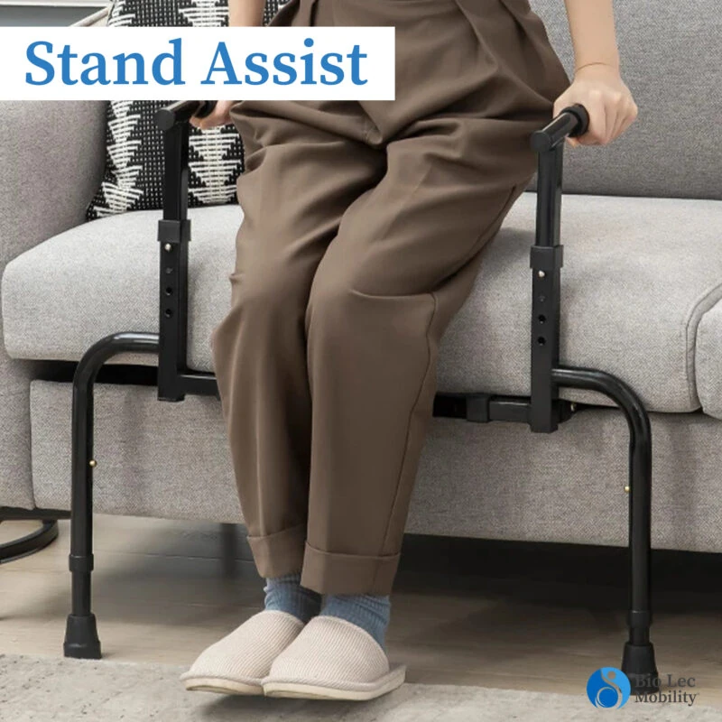 Person using an adjustable sofa stand assist to stand up from a couch.