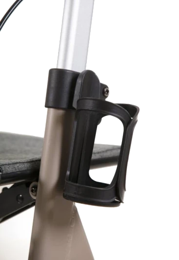 Close-up of a cup holder attached to a rollator walker.