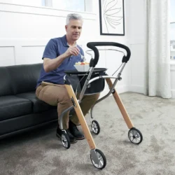 Man sitting on a couch using a rollator with a tray.