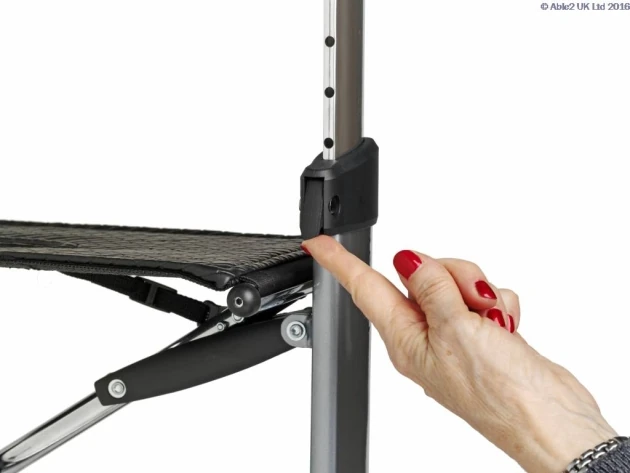 Close-up of a hand adjusting the height on a Let's Fly Rollator.