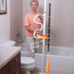 Woman using a white security pole with a curved grab bar in a bathroom.