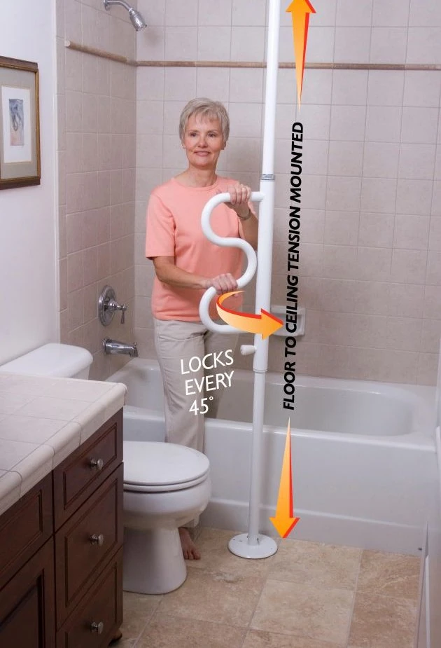 Woman using a white security pole with a curved grab bar in a bathroom.