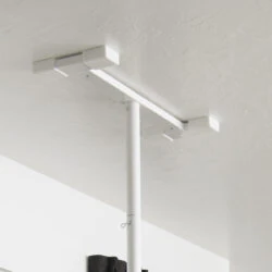 White security pole installed against a ceiling.