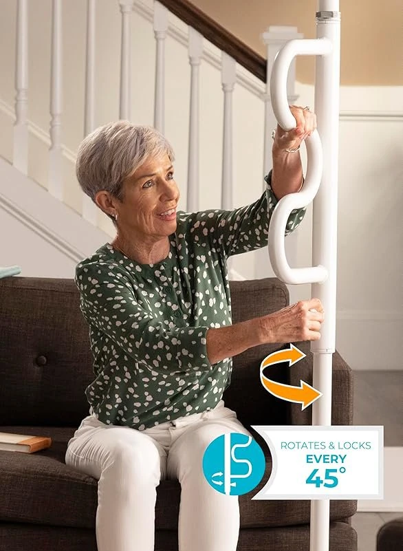 Woman using a white Stander Security Pole by a sofa.