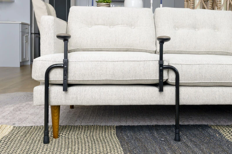 EZ Stand N Go stand assist installed on a sofa.