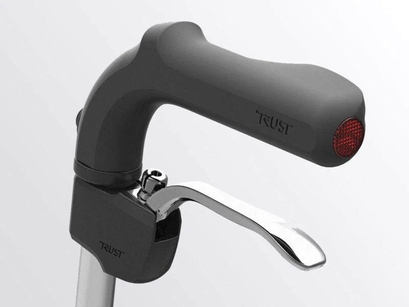 Close-up of Trust Rollator handle with brake lever.