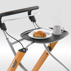 Indoor rollator with tray holding a croissant and coffee.