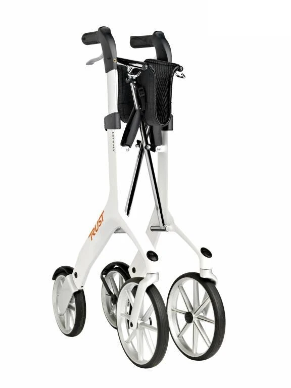 Folded Let's Fly Rollator in white with visible wheels and handles.
