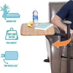 Swivel table attached to a recliner with a bamboo tray holding items.
