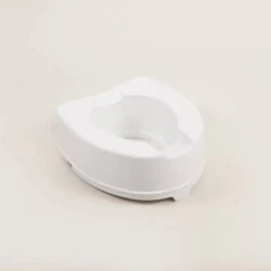 White toilet raiser seat on a plain background.