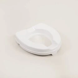 White elevated toilet seat on a plain background.