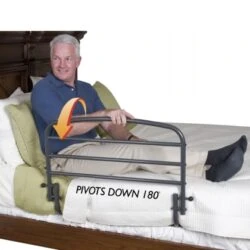 Man sitting on bed with a 30-inch bed support rail.