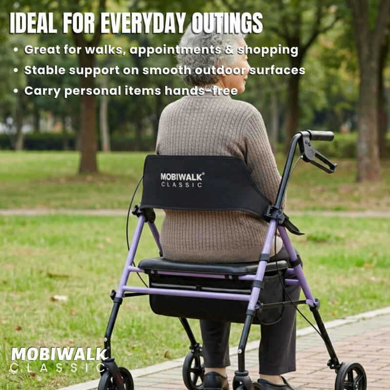 Person sitting on a MobiWalk Classic Rollator in a park.