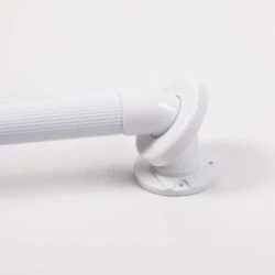 Close-up of a white fluted grab rail with mounting disc.