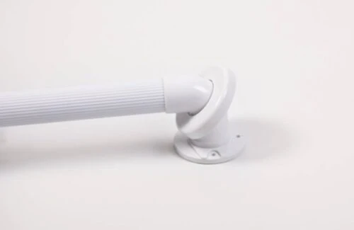Close-up of a white fluted grab rail with mounting disc.