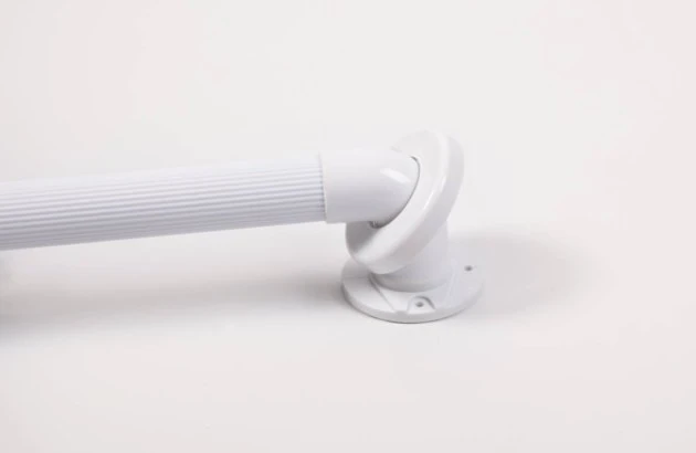 Close-up of a white fluted grab rail with mounting disc.