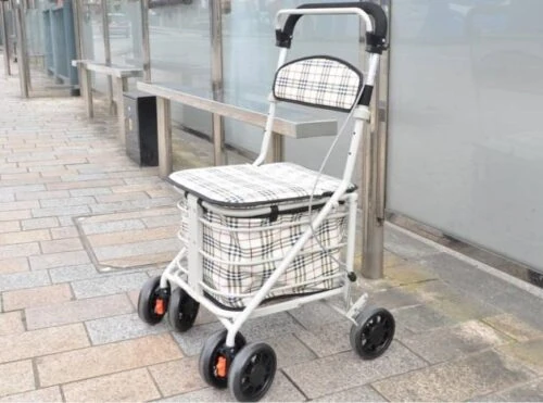 Shopping trolley with seat, four wheels, and a plaid design.