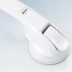 Close-up of a white mobility handle with suction cup base.