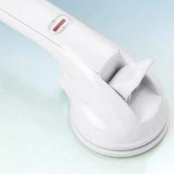 Close-up of a white mobility handle with a suction cup base.