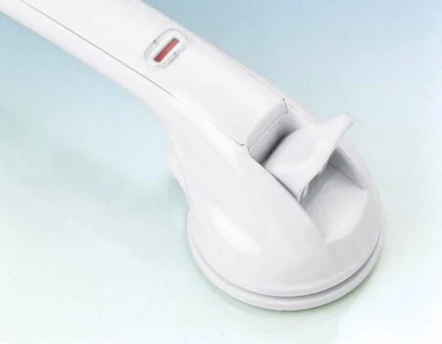Close-up of a white mobility handle with a suction cup base.