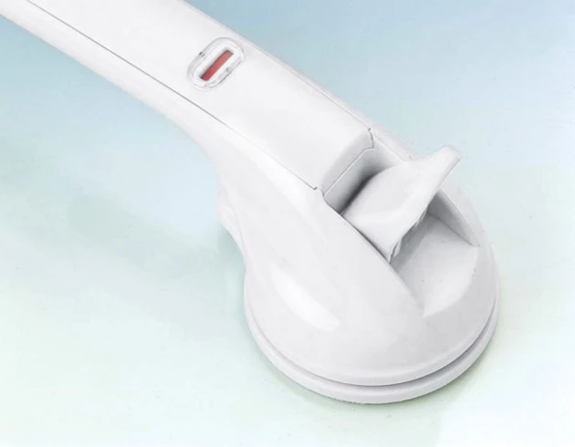 Close-up of a white mobility handle with a suction cup base.
