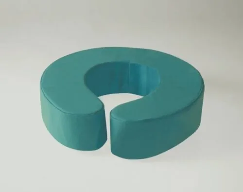 Teal padded toilet seat raiser with a U-shaped design.