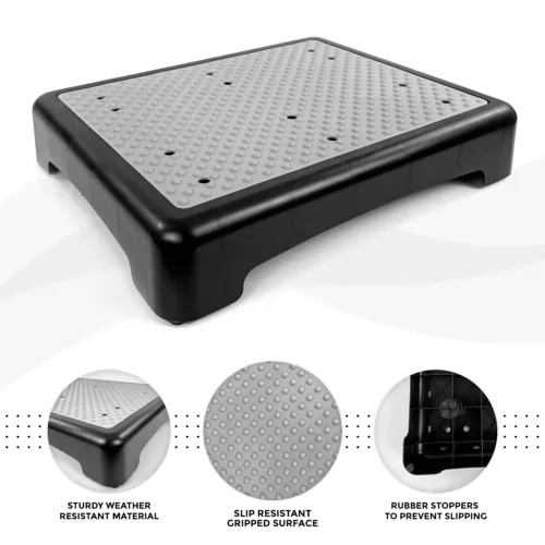 Black and gray outdoor half step with a textured non-slip surface.