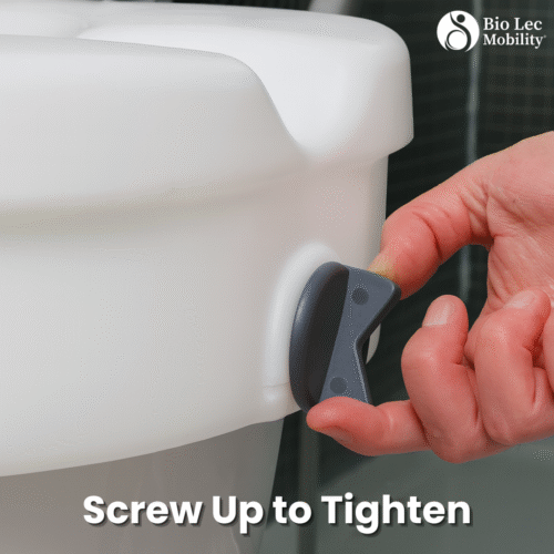 Close-up of hand adjusting screw on a raised toilet seat.