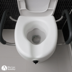 Raised toilet seat with adjustable handles installed on a toilet.