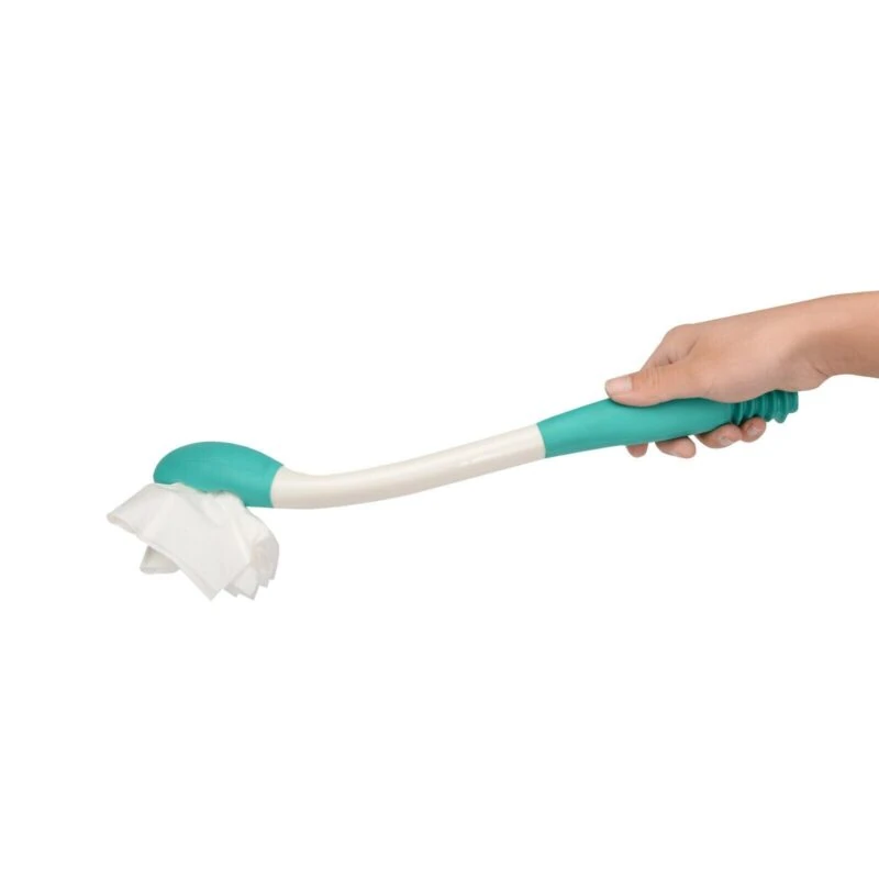 Hand holding a teal and white bottom wiper with tissue.