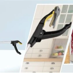 Long reach grabber tool picking up keys and reaching a shelf.