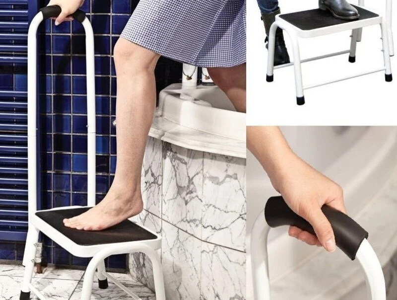 Person using a non-slip safety step with handrail in a bathroom setting.