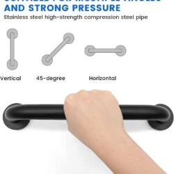 Hand gripping a black bathroom safety handle mounted horizontally.