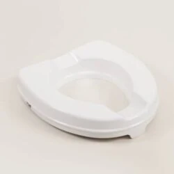 White raised toilet seat without lid on a neutral background.