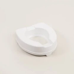 White raised toilet seat on a plain background.