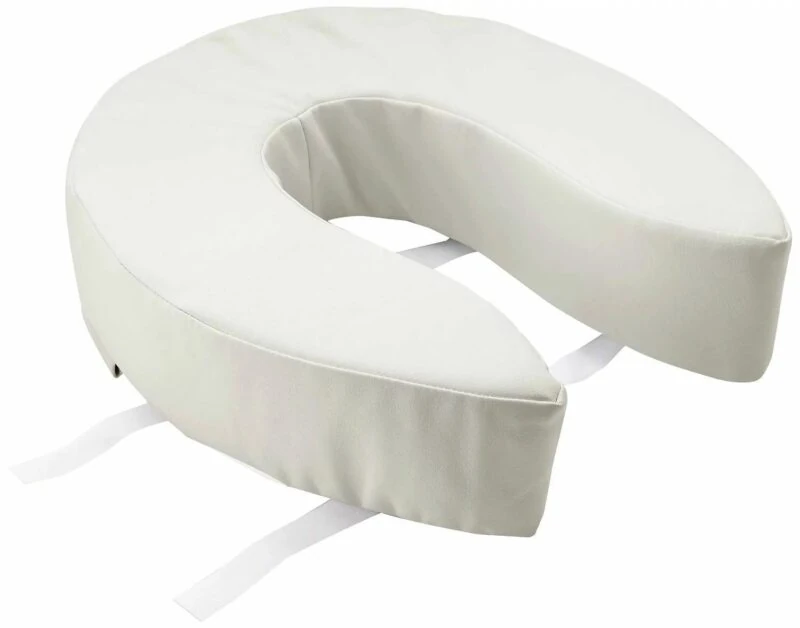 Cushioned padded toilet seat with velcro straps for secure attachment.