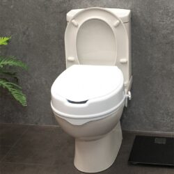 Elevated toilet seat with lid installed on a toilet.