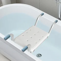 Adjustable bath seat with drainage holes placed over a bathtub.