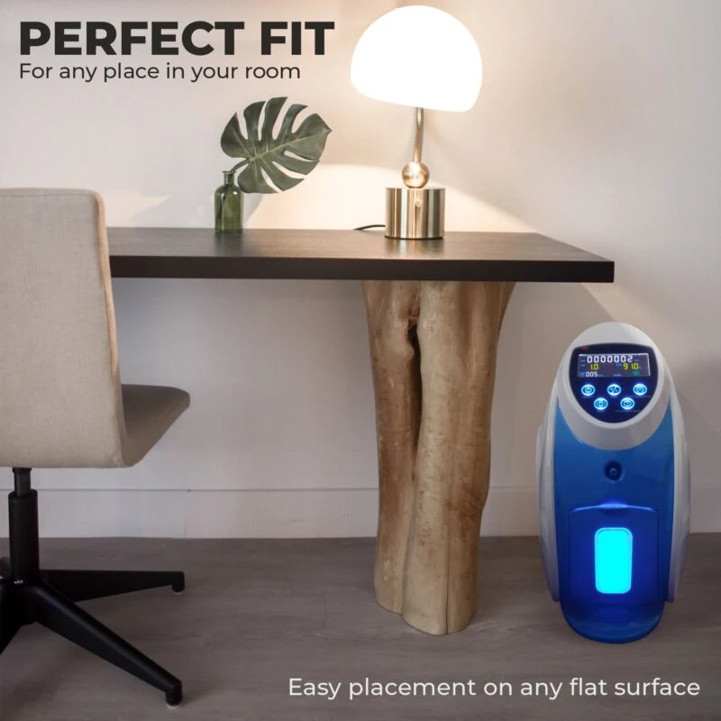 Bio-Lec O2 Concentrator placed beside a desk with a lamp.