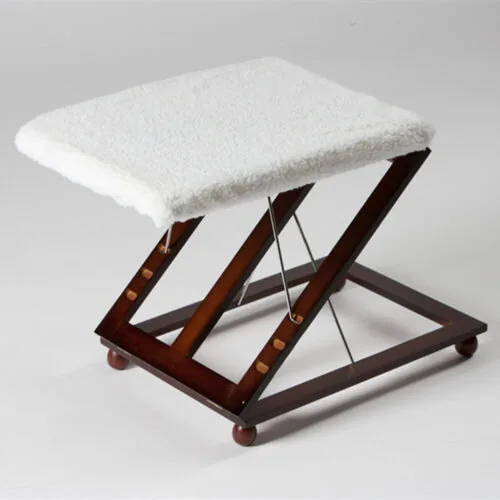 Wooden foot stool with white removable cover and mahogany finish.