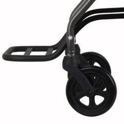 Close-up of a wheelchair's footrest and front wheels.