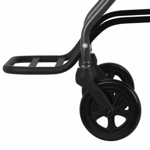 Close-up of a wheelchair's footrest and front wheels.