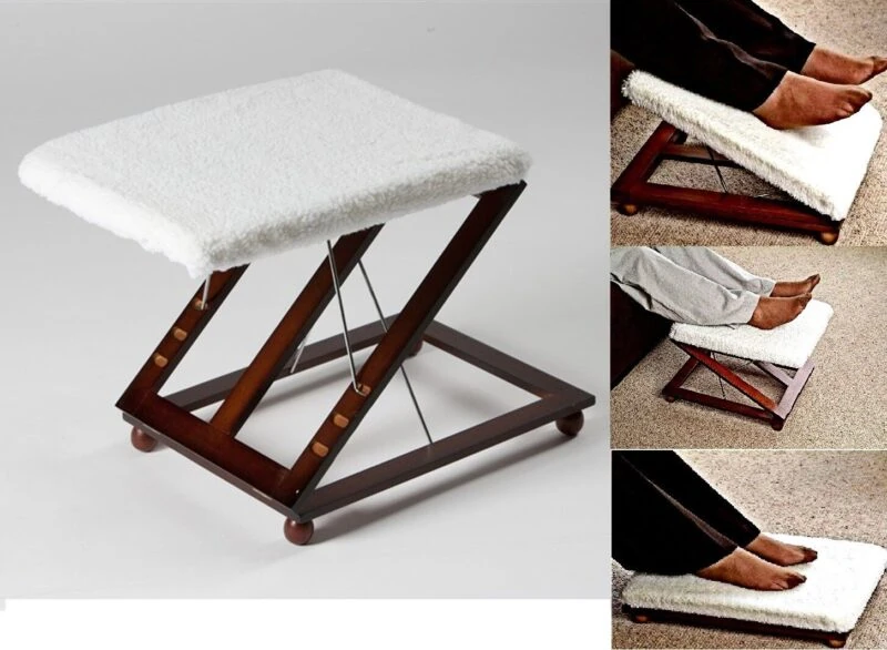 Wooden foot stool with white padded cover and mahogany finish.