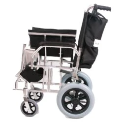 Side view of a folded lightweight travel wheelchair with black seat and large rear wheels.