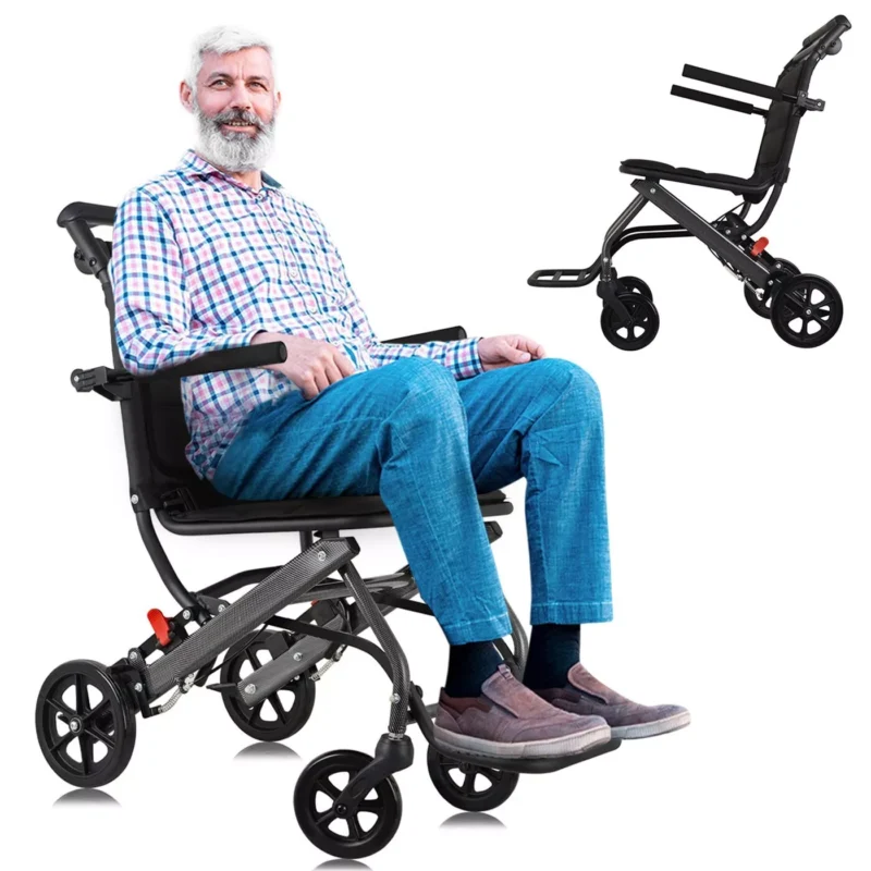 Man sitting in a black aluminium folding travel wheelchair.