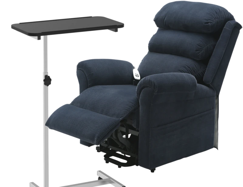 Height adjustable overbed table next to a blue rise recliner chair.