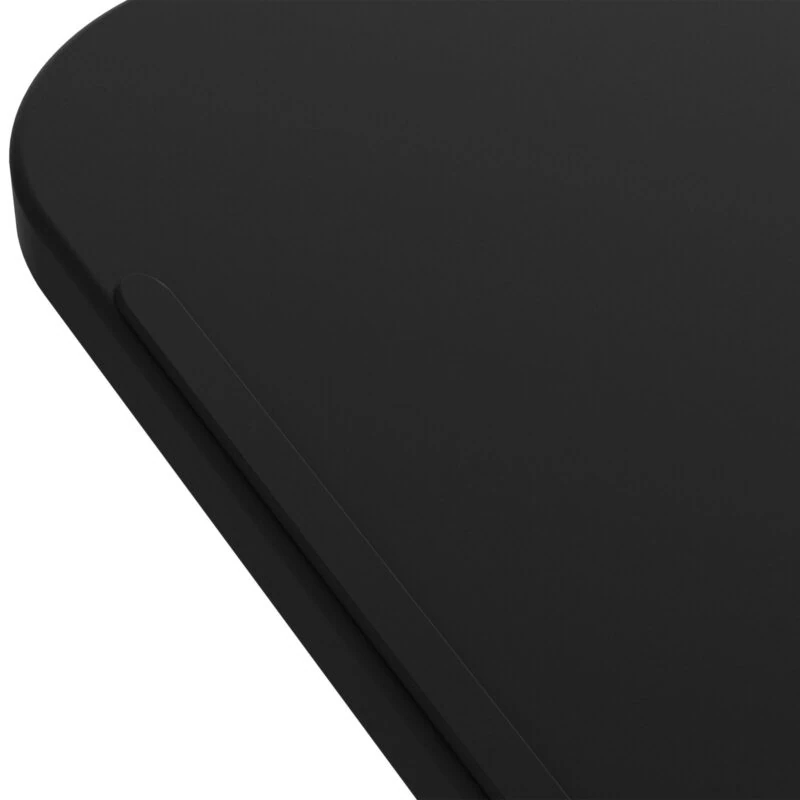 Close-up view of the black surface of the overbed table.